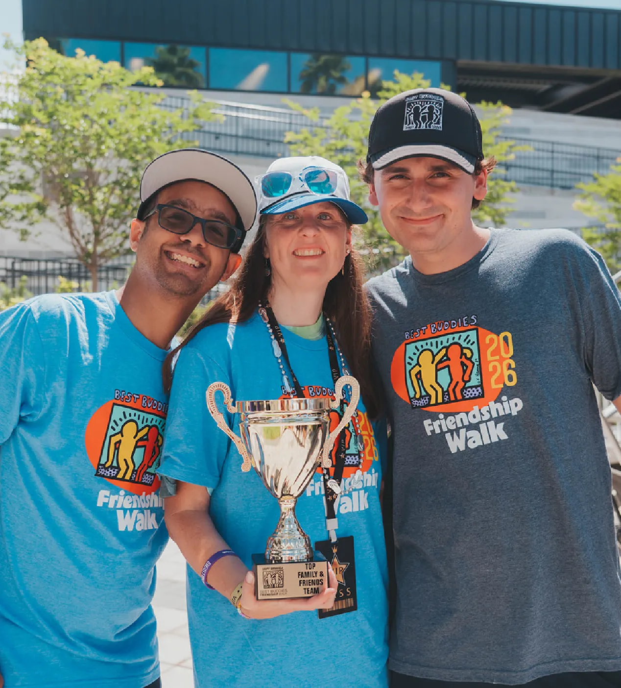 group of participants with fundraising trophy